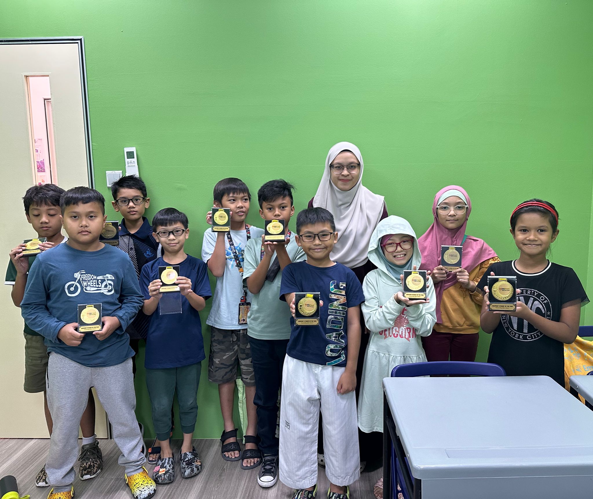 a group of children showing off success in a tuition class